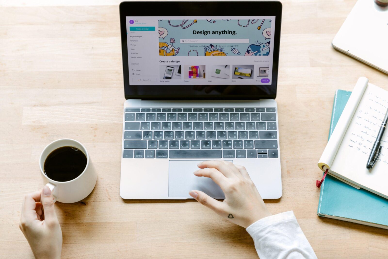Image of person developing website using a laptop